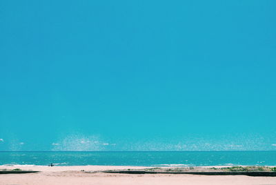 Scenic view of sea against blue sky