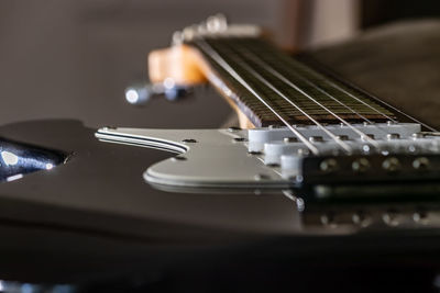 Close-up of guitar on table