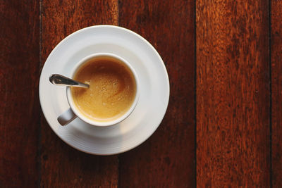 Directly above shot of coffee cup on table