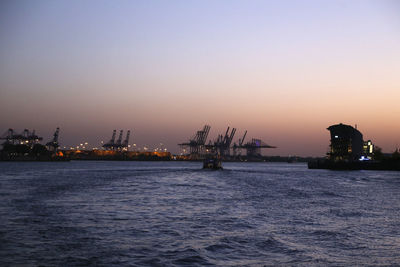 Scenic view of sea against clear sky during sunset