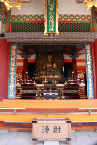 Entrance of temple against building