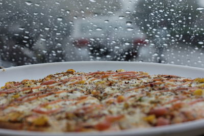 Close-up of pizza served in plate