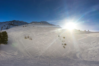 Scenic view of snowcapped mountains against sky