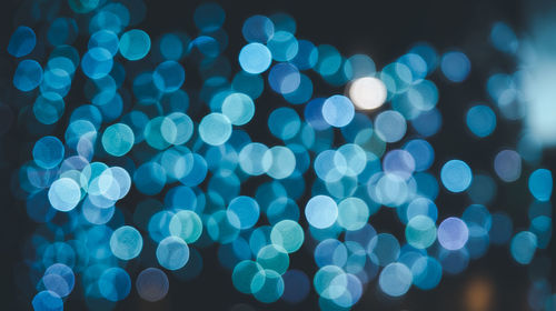 Defocused image of illuminated lights at night