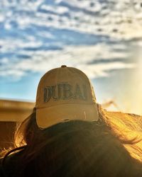 Close-up of text on land against sky