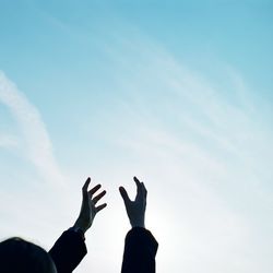 Low angle view of people against sky