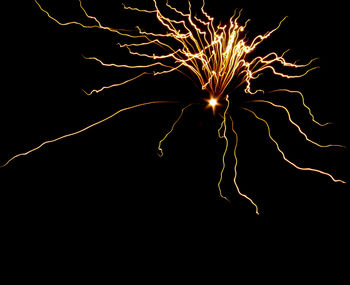 Firework display over black background