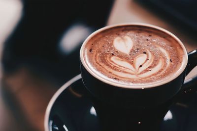 Close-up of cappuccino on table