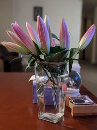 Close-up of purple flower vase on table