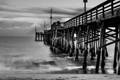 Pier on sea against sky