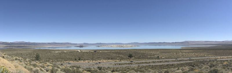 Scenic view of land against clear blue sky