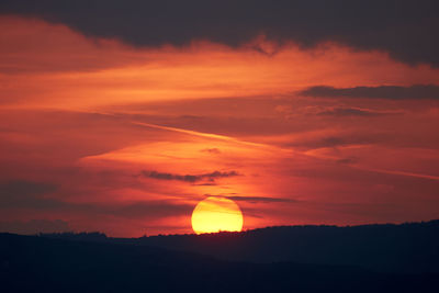 Scenic view of silhouette landscape against romantic sky at sunset