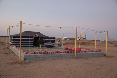 Lifeguard hut on beach against clear sky