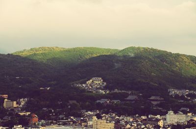 Scenic view of tree mountains against sky