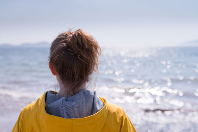 Woman standing against sky