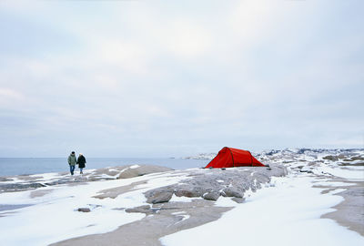 Couple on rocky coast