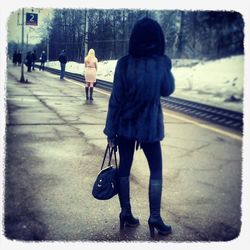 Woman walking on road