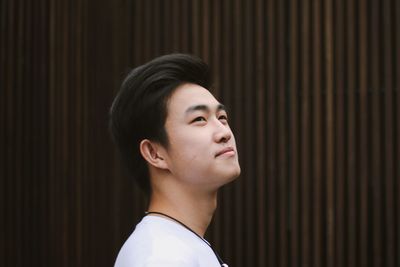 Close-up of young man looking away outdoors