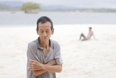 Portrait of man standing on beach