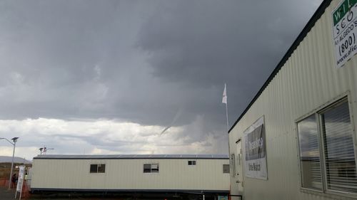 Low angle view of building against cloudy sky