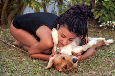 Portrait of young woman with dog