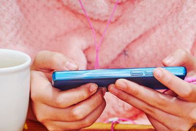 Midsection of man using mobile phone