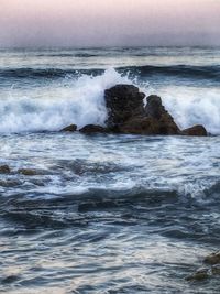 Waves splashing on rocks