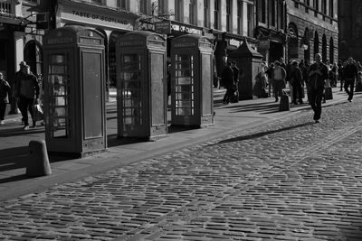 People walking on street in city