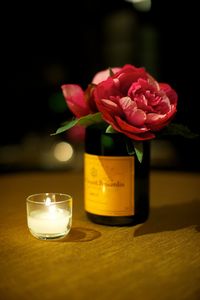 Close-up of rose flower vase on table