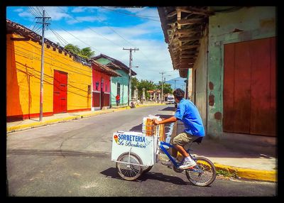 Man riding bicycle on street