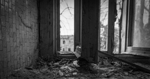 Damaged window in abandoned building