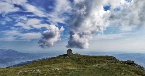 Panoramic view of sea and mountains against sky