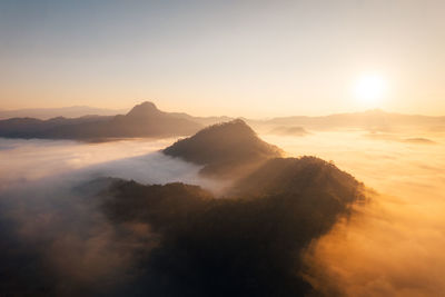 Scenic view of mountains against sky during sunset