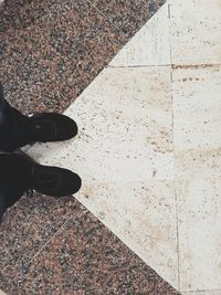 Low section of man standing on floor