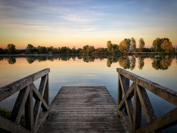 Pier over lake against sky