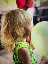 Close-up of girl holding balloon