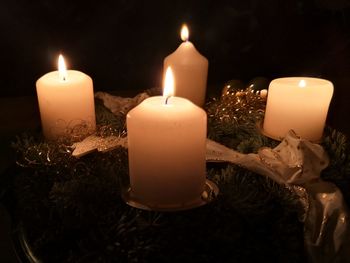 Close-up of illuminated tea light candles