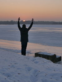 Full length of man on beach at sunset