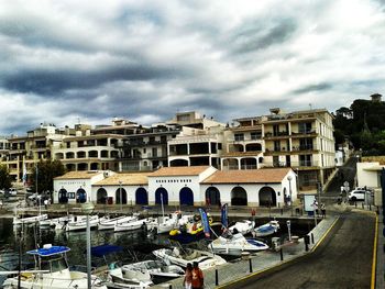 View of buildings against cloudy sky