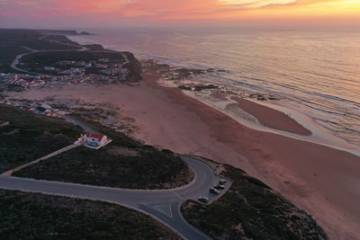 High angle view of sea against sky during sunset