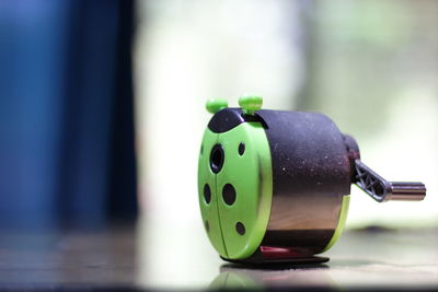 Close-up of green toy on table