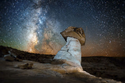 Statue against sky at night