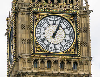 Low angle view of clock tower against sky