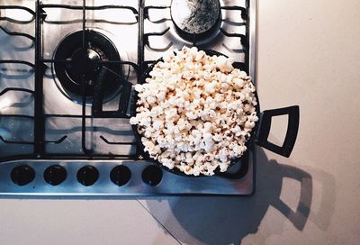 High angle view of popcorns in frying pan on stove at kitchen