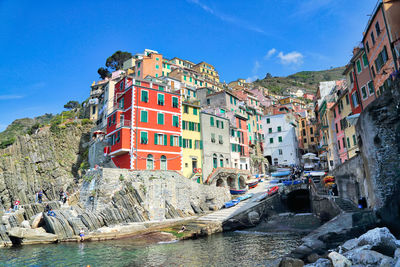 Panoramic view of buildings and sea against sky