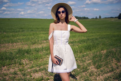 Young woman standing on field