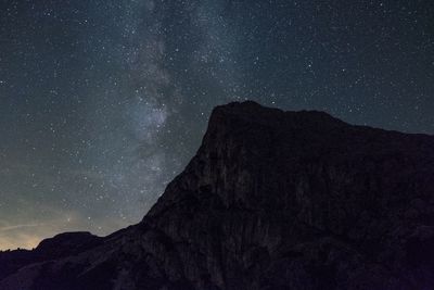 Low angle view of mountain against sky at night