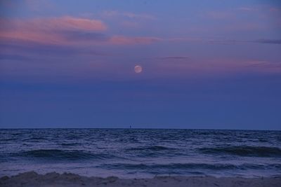 Scenic view of sea against sky at sunset