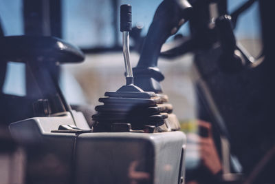 Gearshift of tractor seen through window