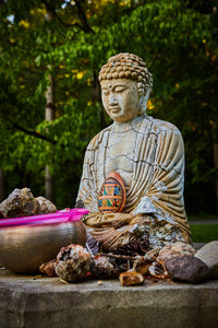 Rear view of man sitting on plant